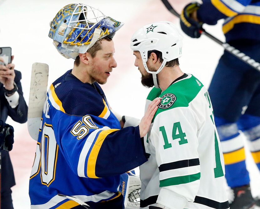 Dallas Stars left wing Jamie Benn (14) congratulates St. Louis Blues goaltender Jordan...