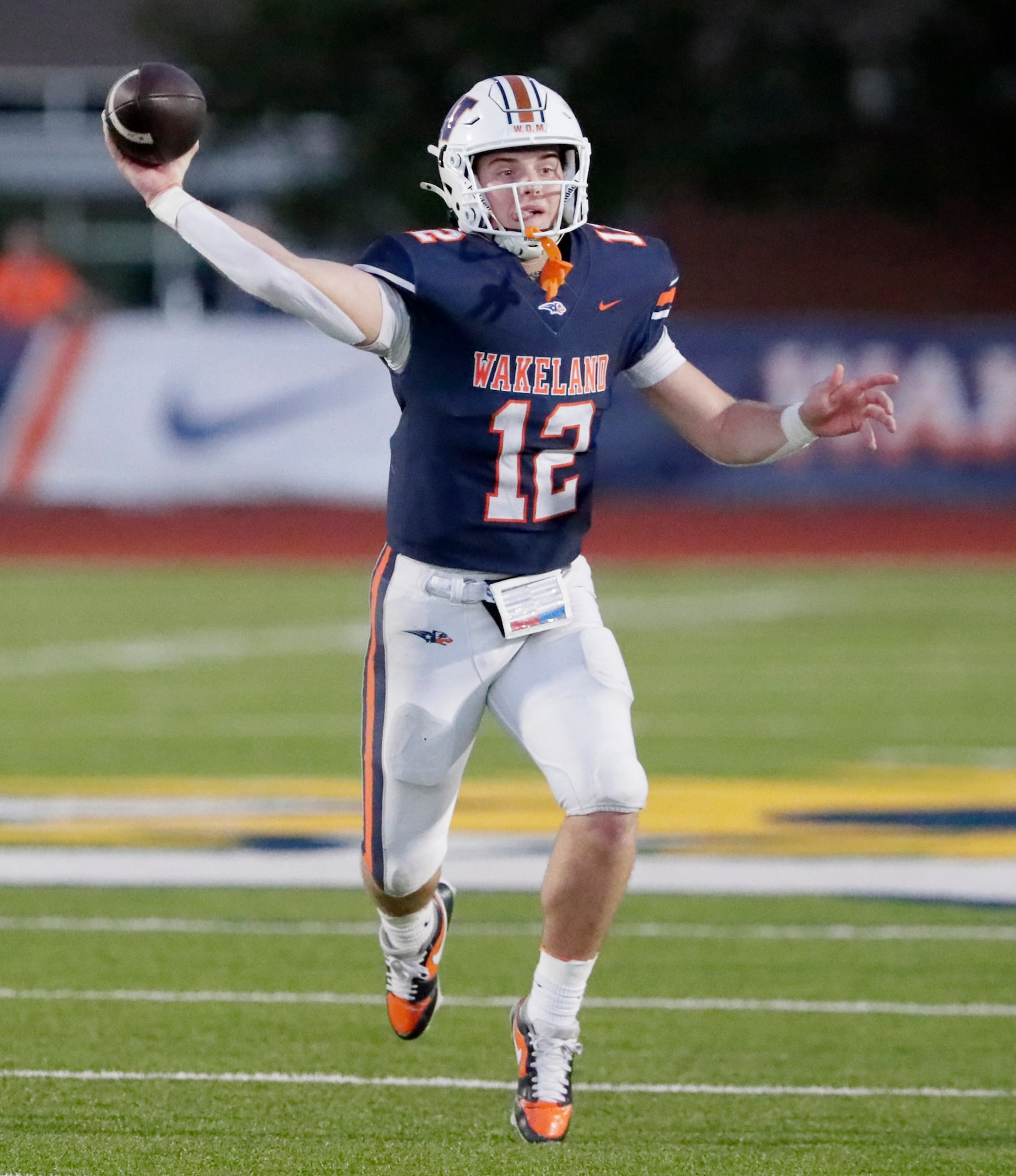 Wakeland High School quarterback Jayden Maples (12) launches a pass during the first half as...