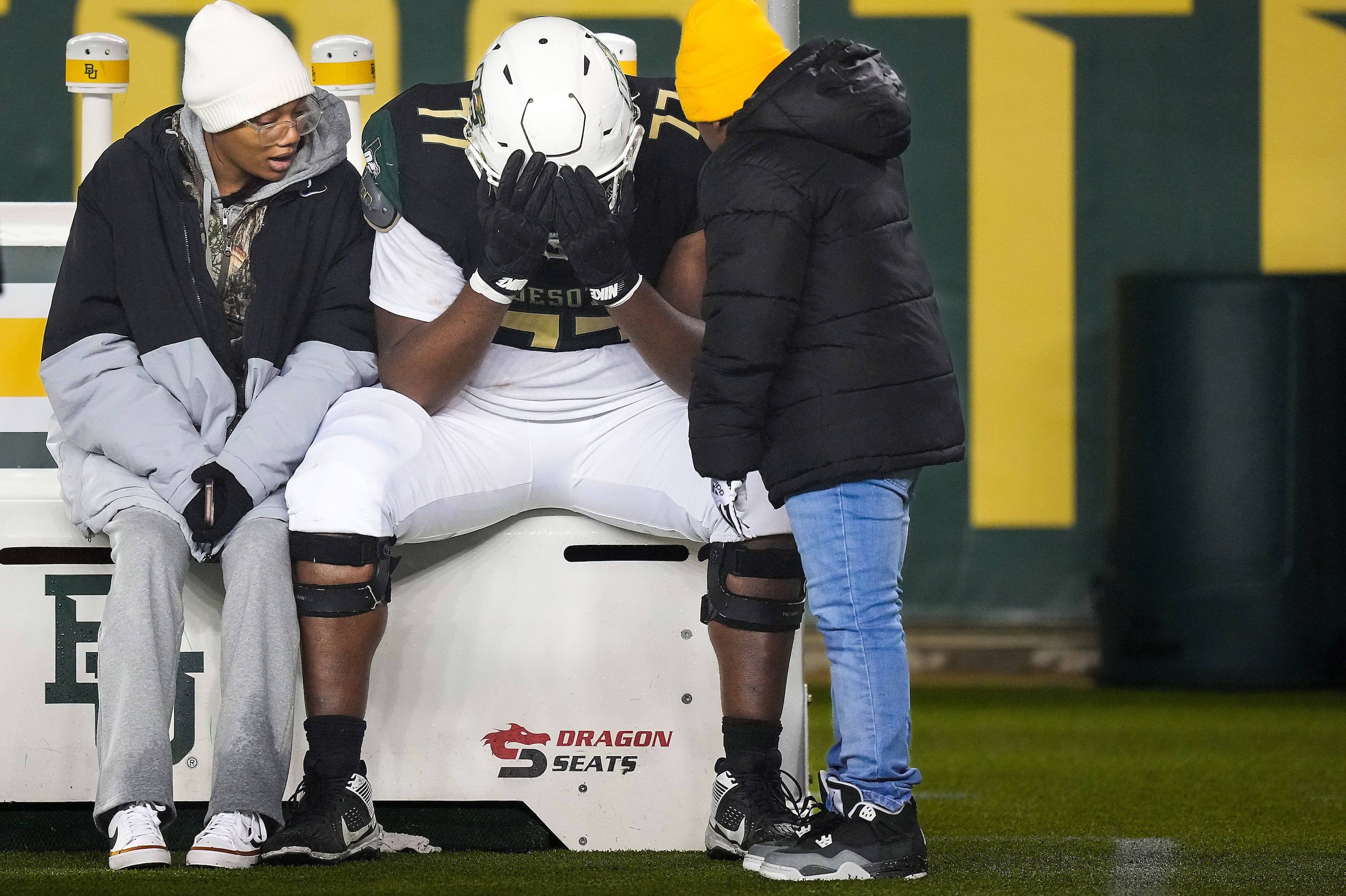 DeSoto offensive lineman Vincent Williams II lingers on the bench after a loss to Longview...