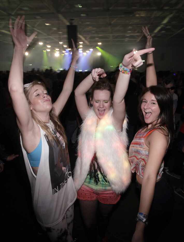 Guests dance during the Lights All Night festival at the Dallas Convention Center in Dallas,...