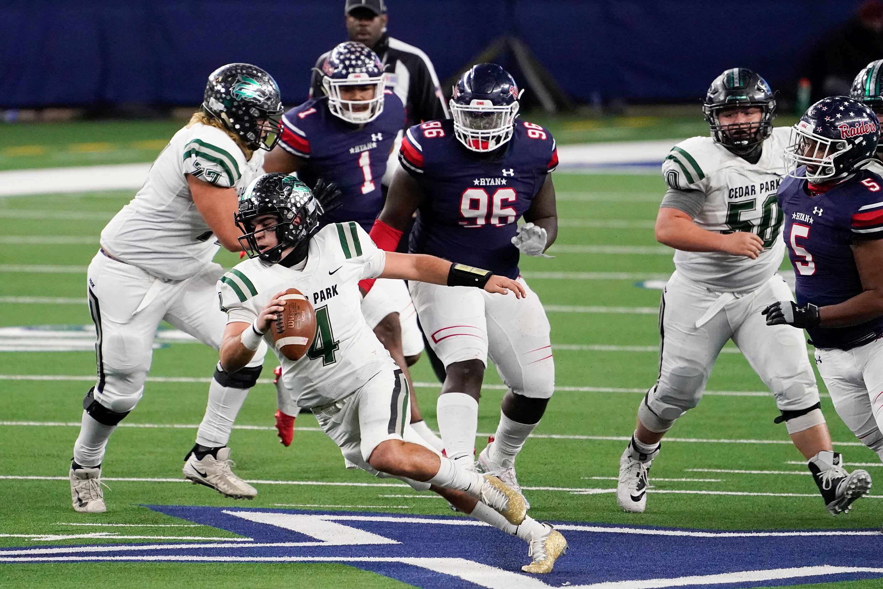 Cedar Park quarterback Ryder Hernandez (4) is flushed from the pocket by Denton Ryan...