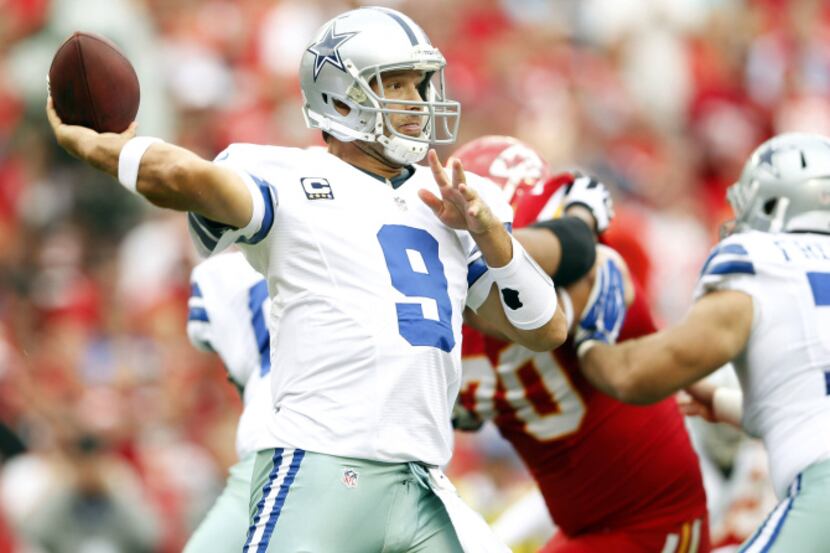 Dallas Cowboys quarterback Tony Romo (9) looks to pass in a game against the Kansas City...