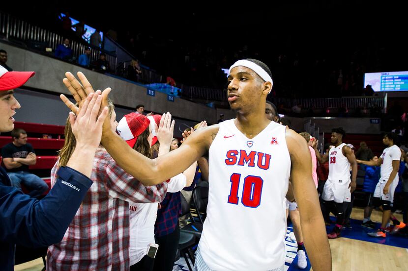 SMU guard Jarrey Foster celebrates with fans after a win over Tulane in an NCAA basketball...