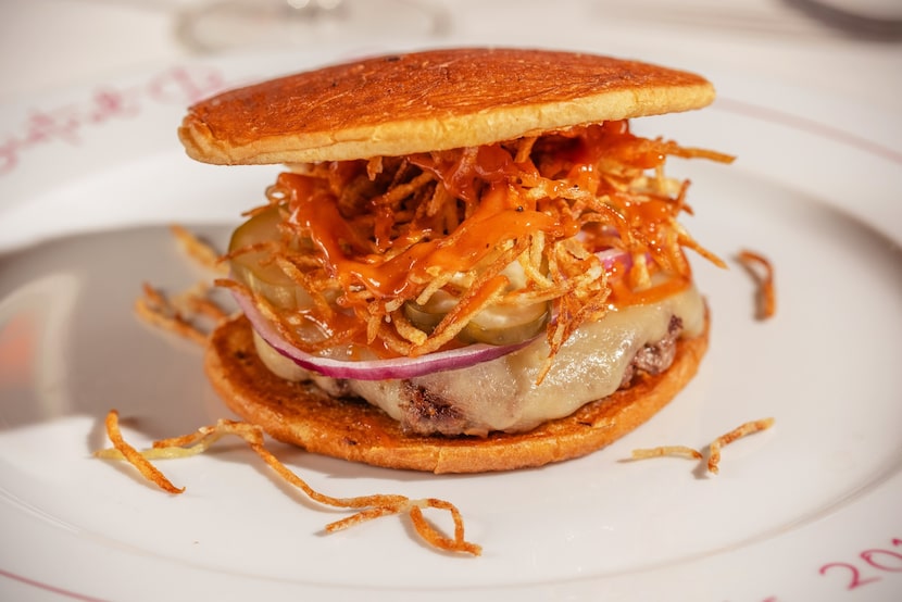 A look at Le Bistrot Bar Sardine's take on a cheeseburger ($21) with white cheddar, barbecue...