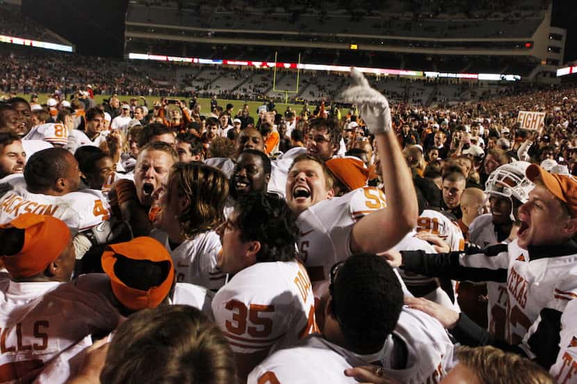 Texas Longhorns long snapper John Osborn (59) cheers with his team after winning the Texas...