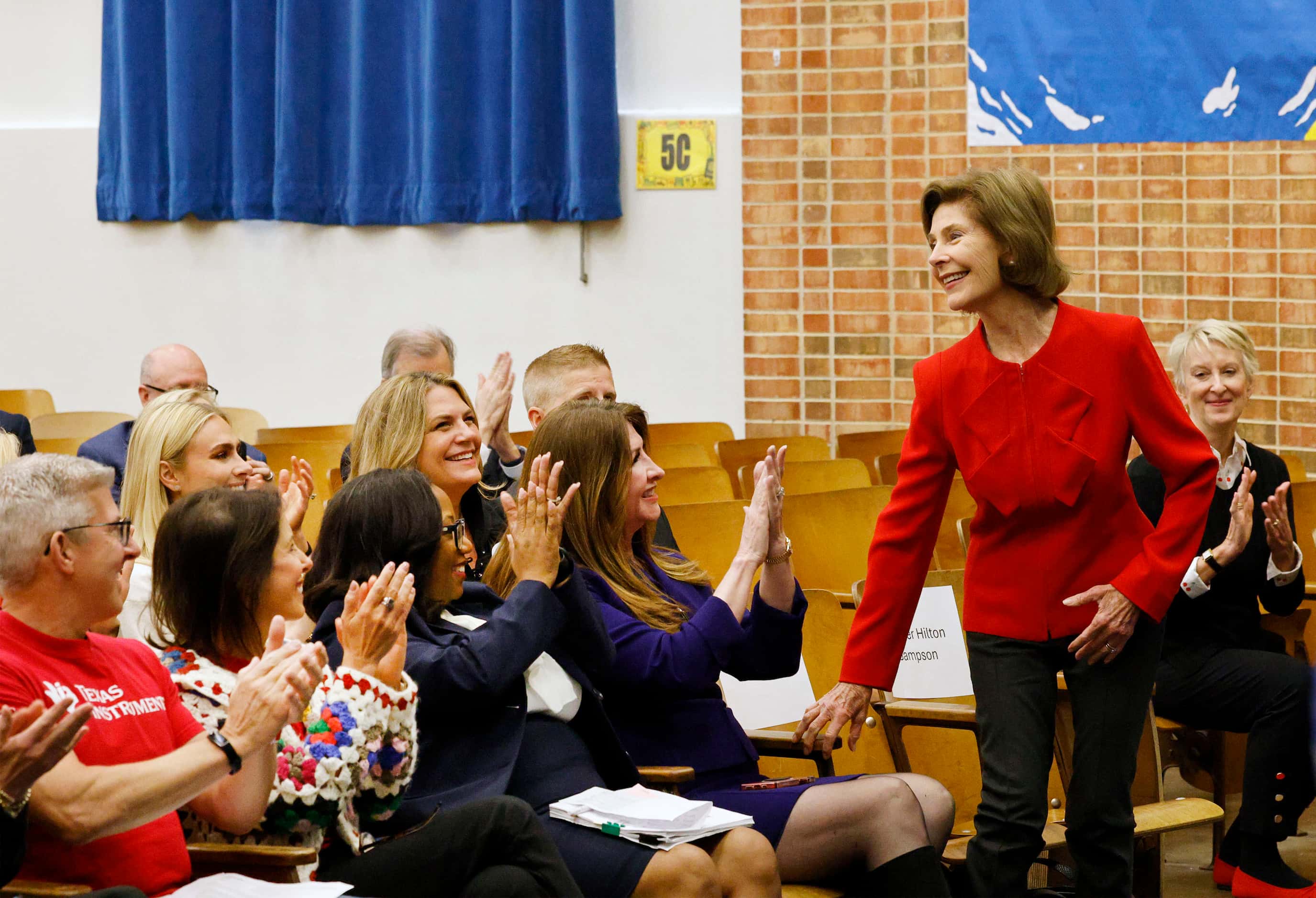 Former first lady Laura Bush, right, is introduced during a reading day event hosted by...