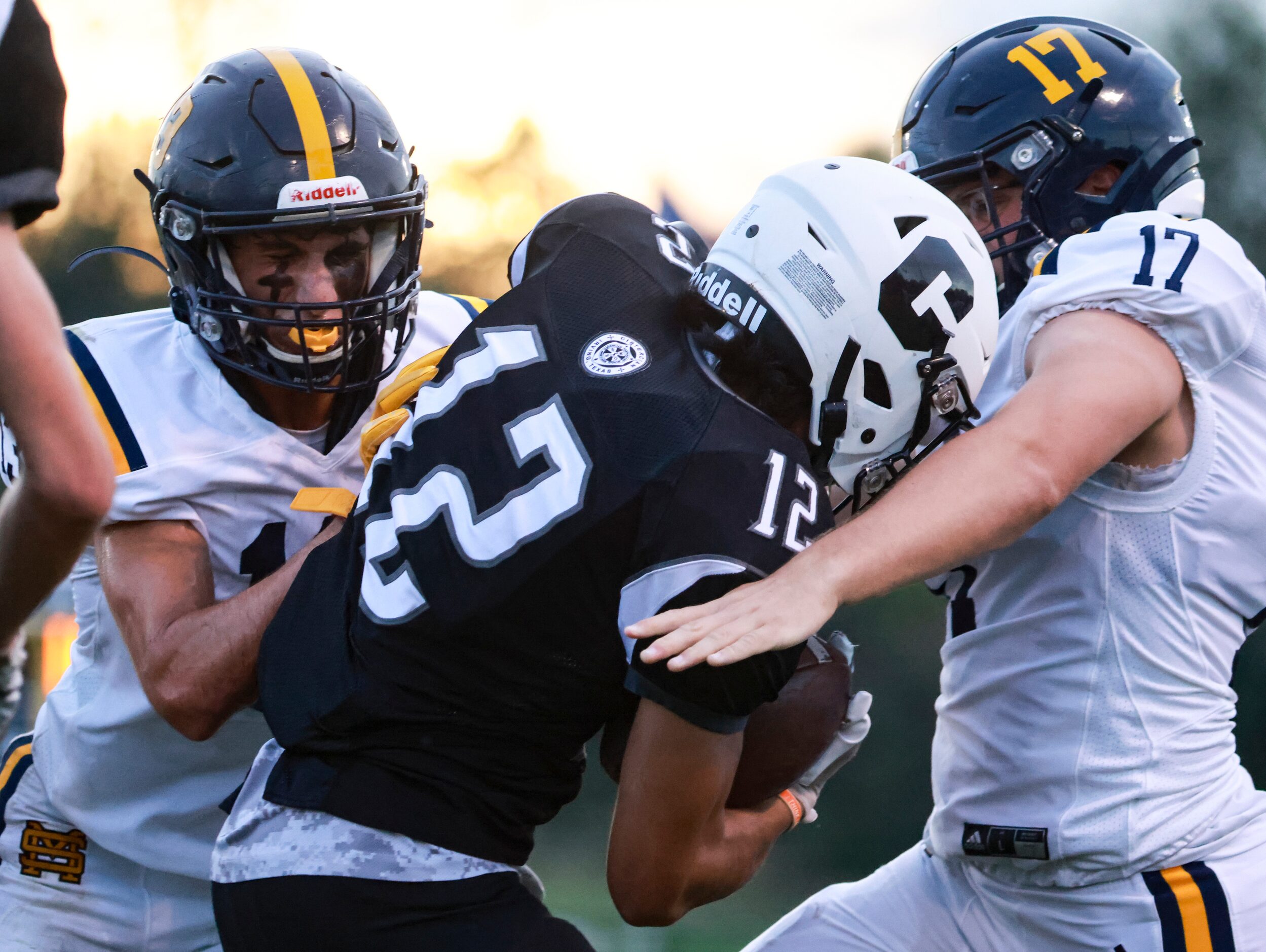 Cistercian Preparatory School JP Roppolo (12) gets tackled by St. Mark's School of Texas...