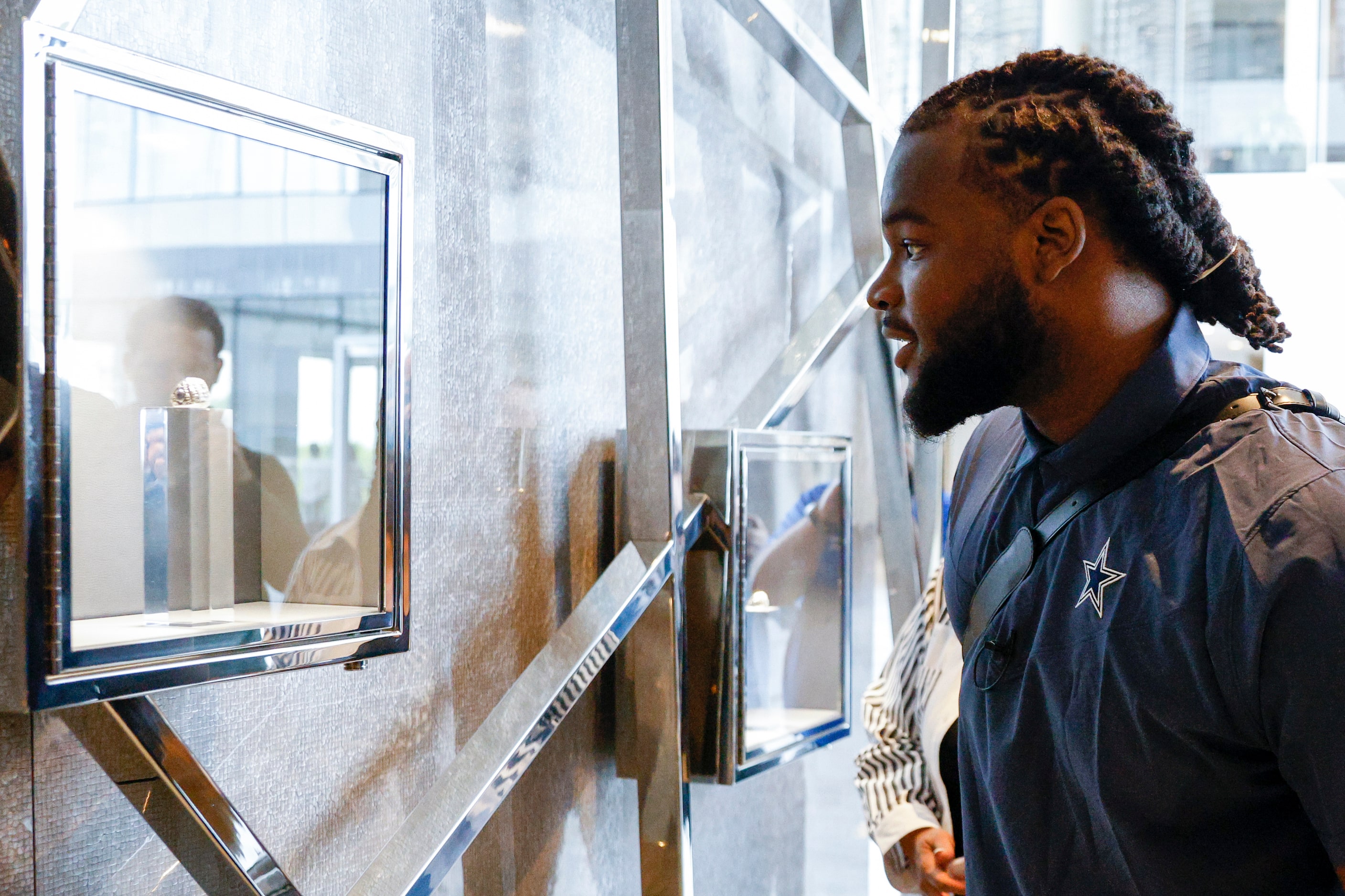 Dallas Cowboys first round pick Mazi Smith views the Cowboys Super Bowl rings after arriving...