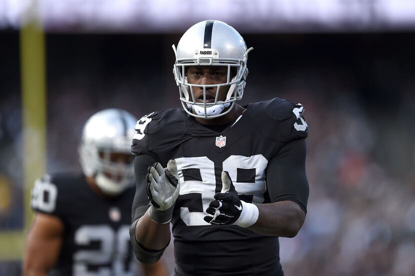 OAKLAND, CA - NOV. 15, 2015: Raiders outside linebacker Aldon Smith (99) celebrates in the...