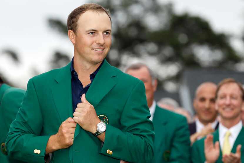 Jordan Spieth wears his green jacket after winning the Masters golf tournament Sunday, April...