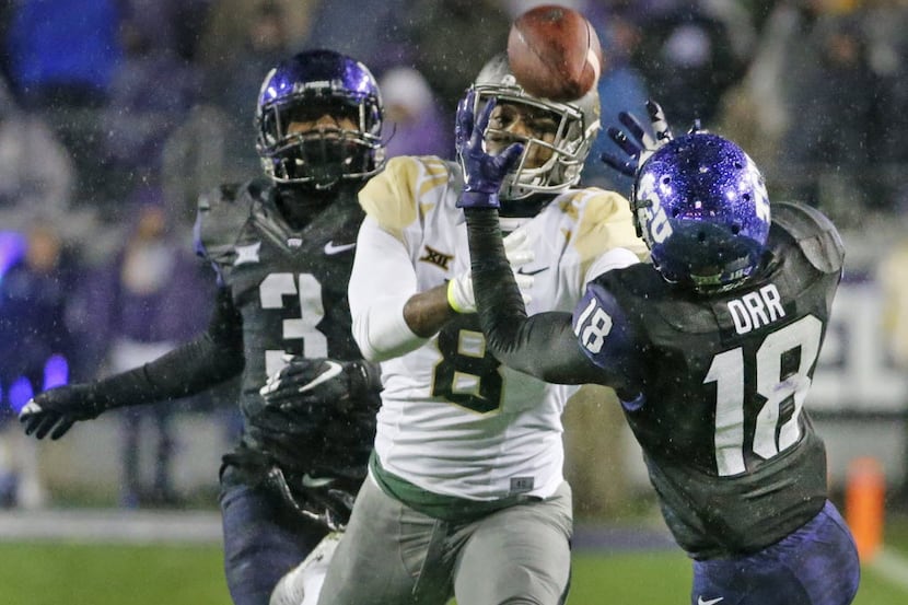 TCU Horned Frogs safety Nick Orr (18) intercepts a pass intended for Baylor Bears wide...