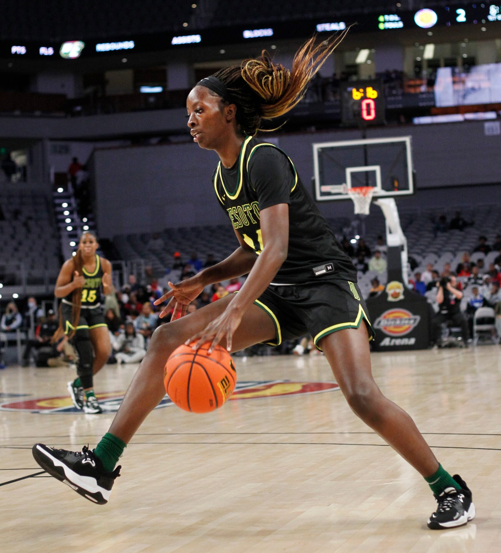 DeSoto senior Amina Muhammad (14) drives to the basket during first half action against...