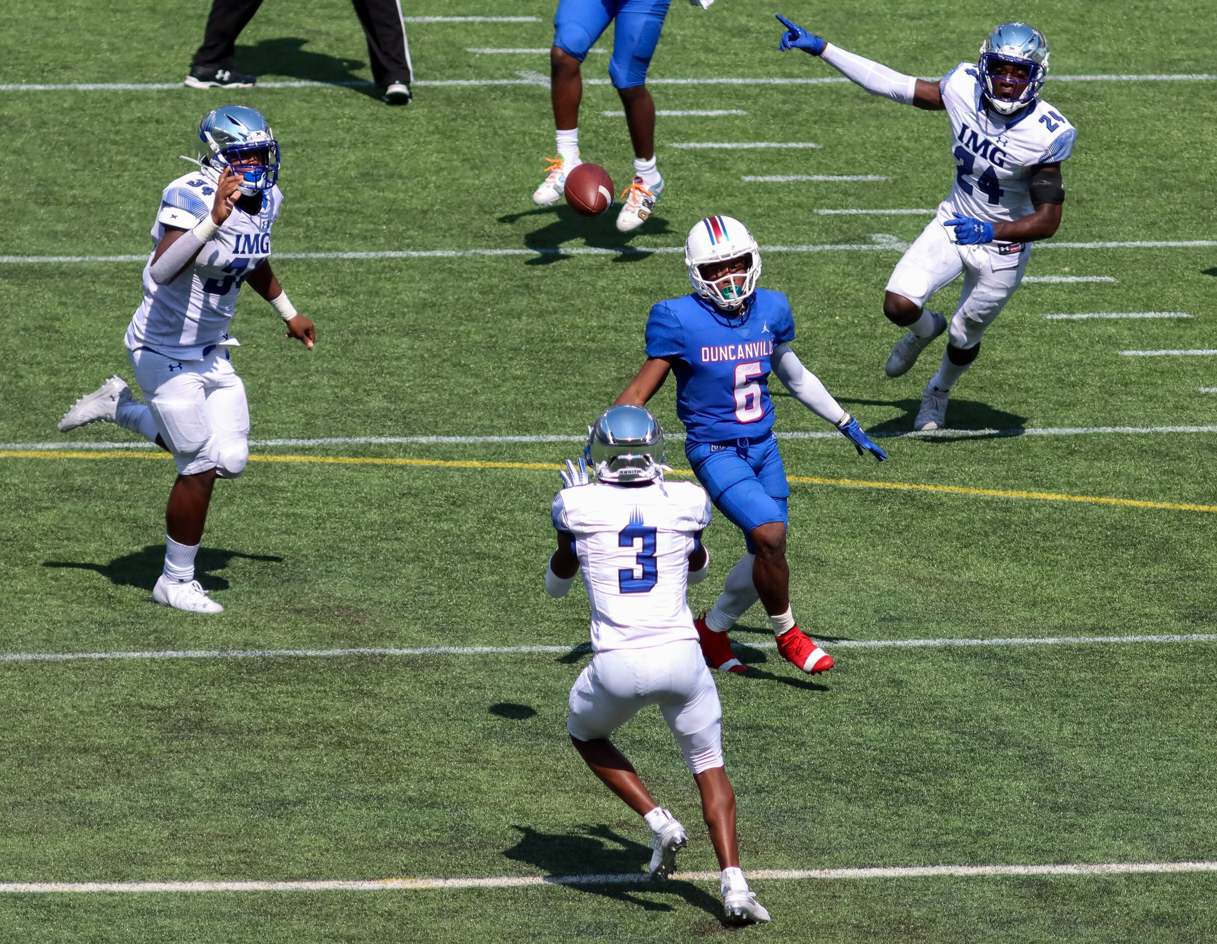 IMG Academy defensive back Omar Burroughs (3) intercepts a pass intended for Duncanville...