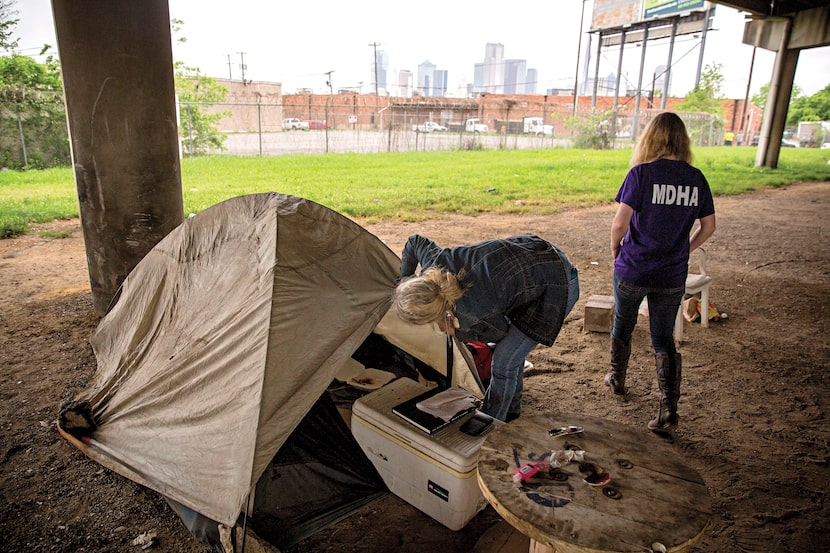 On April 19, Cindy Crain (left) and Rebecca Cox of the Metro Dallas Homeless Alliance sifted...