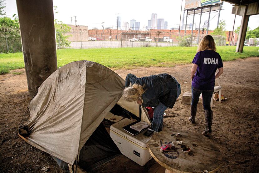 On April 19, Cindy Crain (left) and Rebecca Cox of the Metro Dallas Homeless Alliance sifted...
