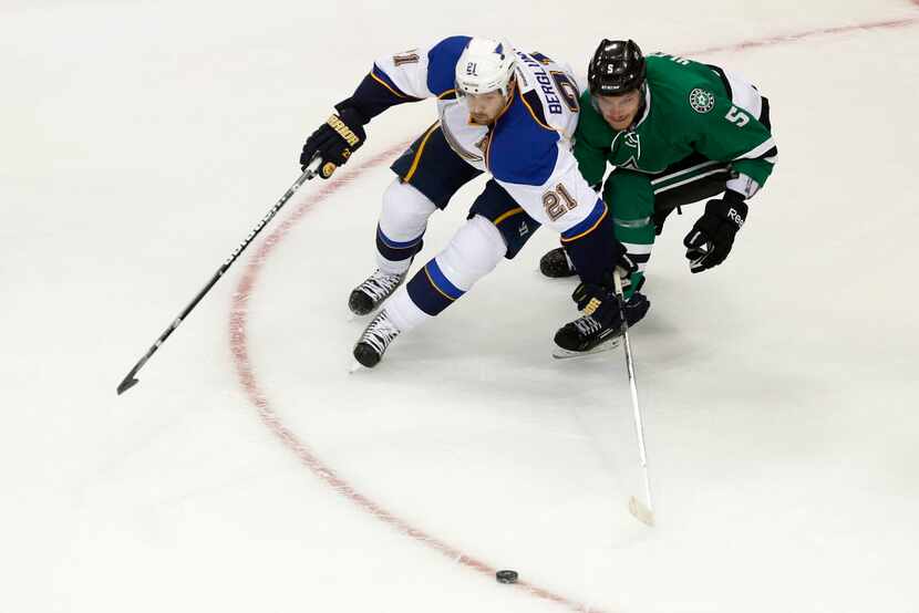 Dallas' Jamie Oleksiak (5) skates against St. Louis' Patrik Berglund (21) during a preseason...