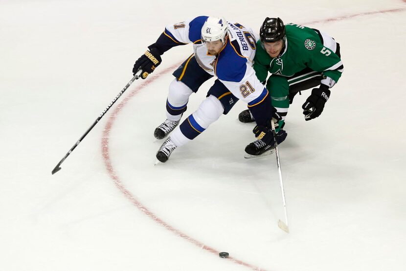 Dallas' Jamie Oleksiak (5) skates against St. Louis' Patrik Berglund (21) during a preseason...