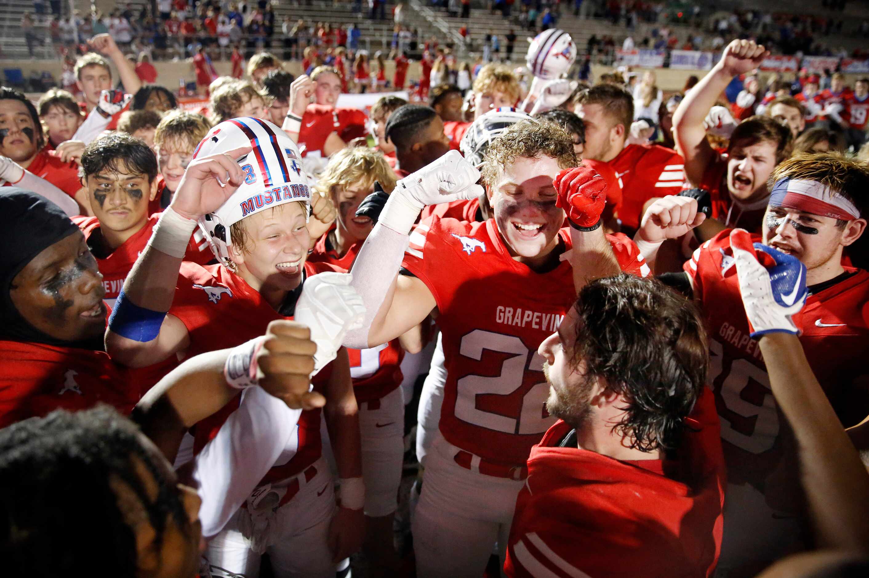 Grapevine football players celebrate their 31-14 win over Lake Dallas in the Class 5A...