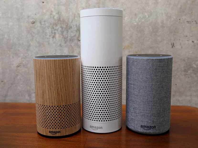 Amazon Echo Plus, center, and Echo devices are pictured at an Amazon event in September.
