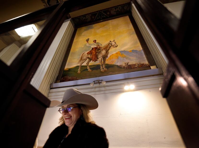 Junior League of Fort Worth member Claudia Thompson works in the old ticket booth below a...