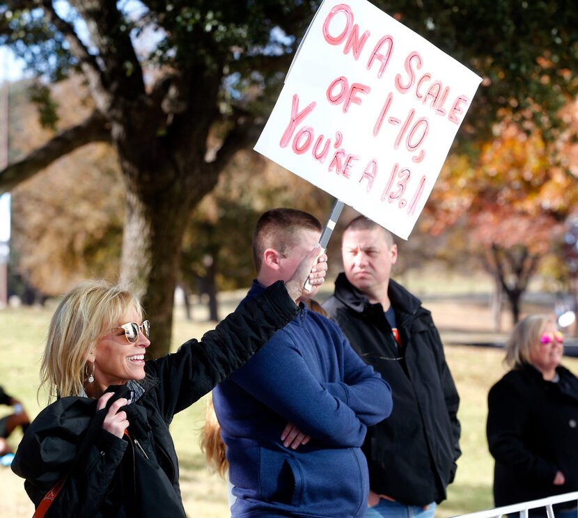 Gilian Baron cheers on her daughter Allie Baron, who ran the half marathon, during the BMW...