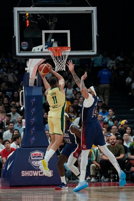 Australia's Dante Exum (14) puts up a shot as USA's Anthony Davis (14) defends during the...