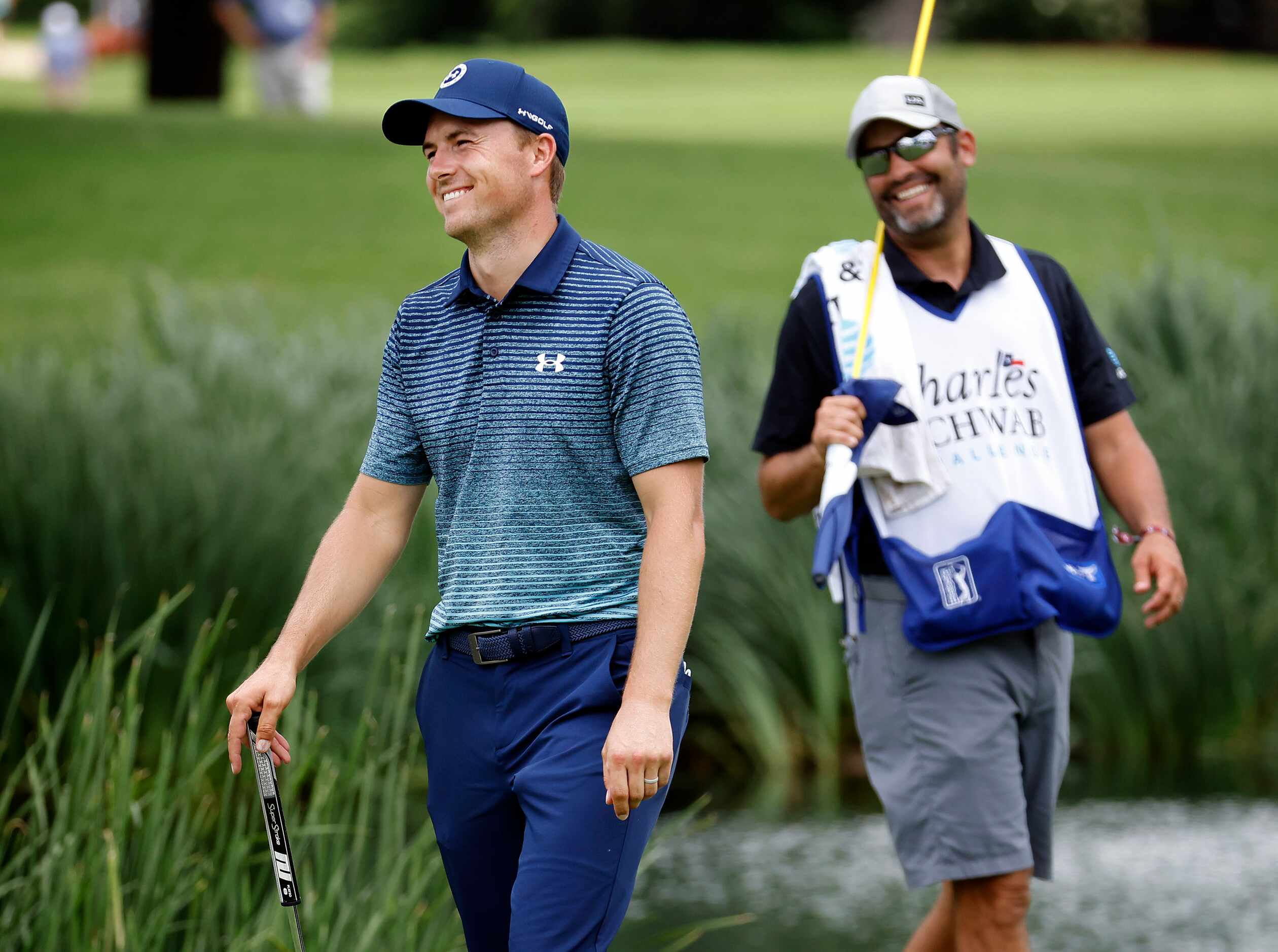 Professional golfer Jordan Spieth reacts to something said by Phil Mickelson after Jordan...