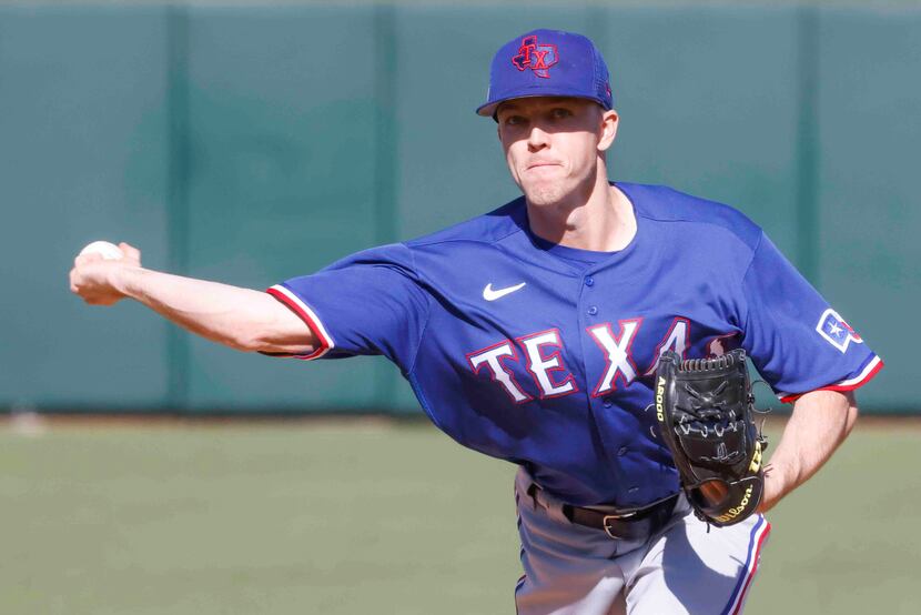 Texas Rangers Chase Lee throws a pitch during the seventh inning of a spring training game...