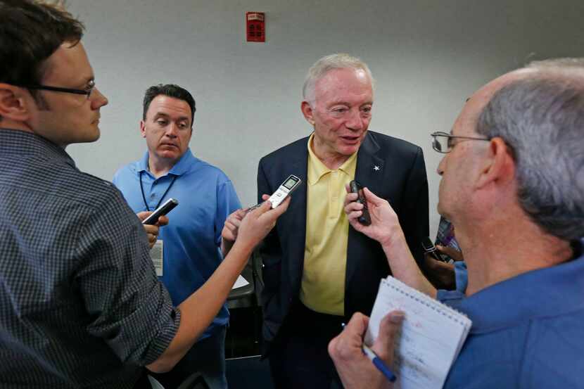 Dallas Cowboys owner Jerry Jones talks to reporters after a pre-draft press conference at...