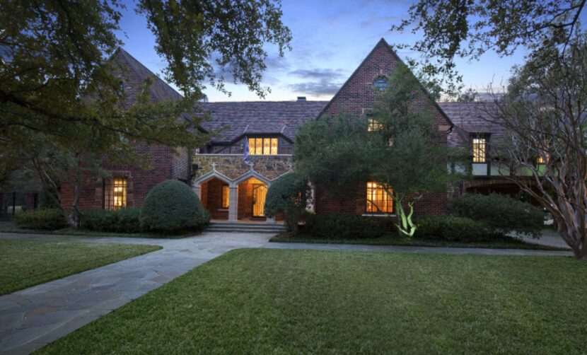 A classic Tudor on Preston Parkway includes cast-stone accents, multicolor brick, a colorful...