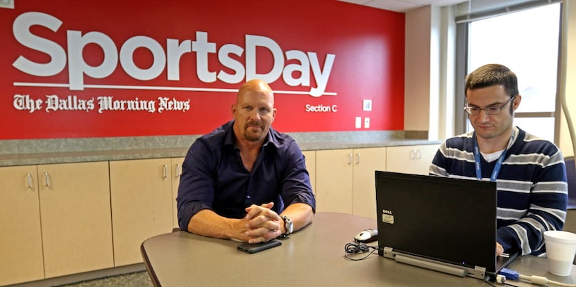 WWE Hall of Famer "Stone Cold" Steve Austin, left, chats with Mark Francescutti at The...