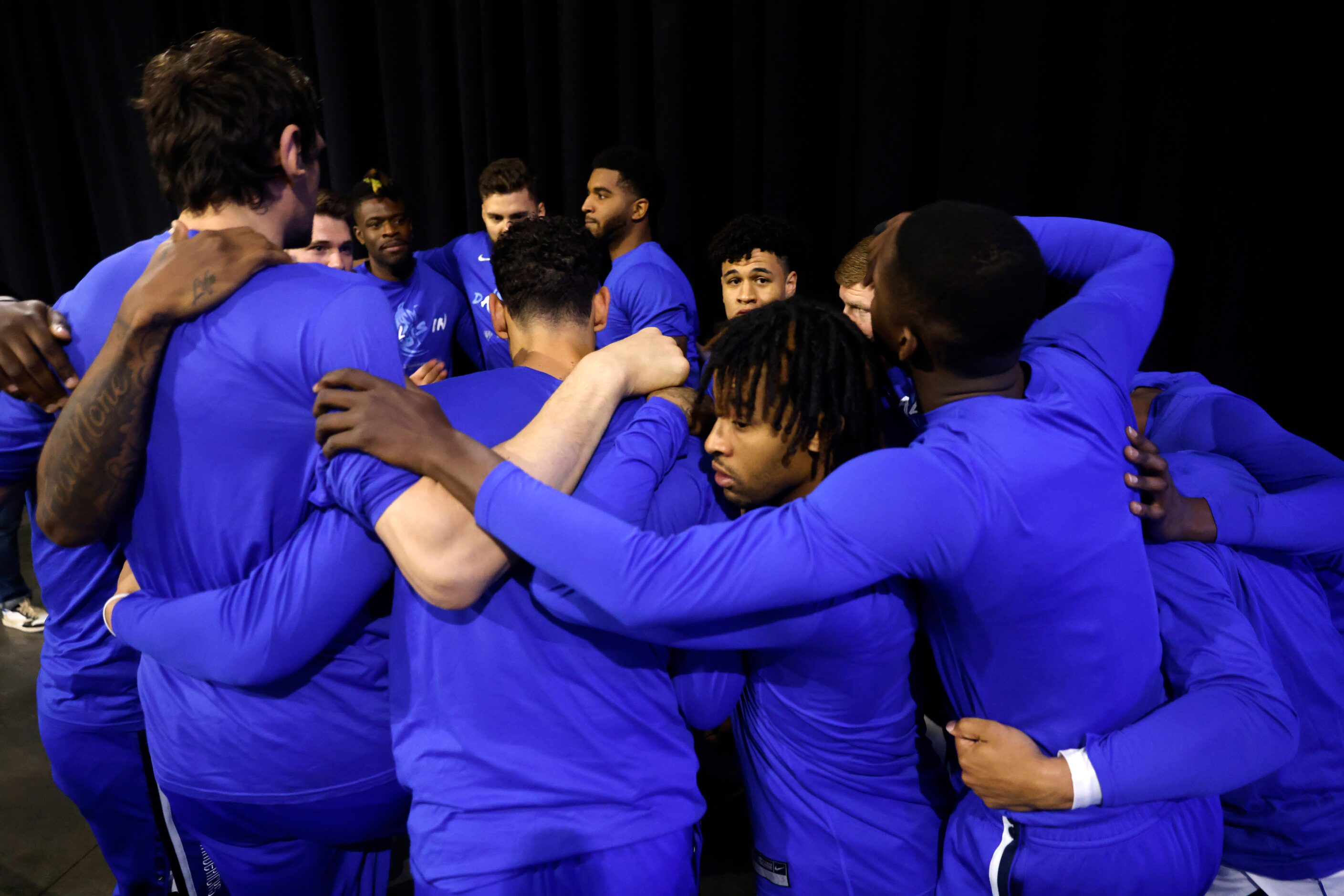 The Dallas Mavericks huddle in the tunnel before taking the court against the Golden State...