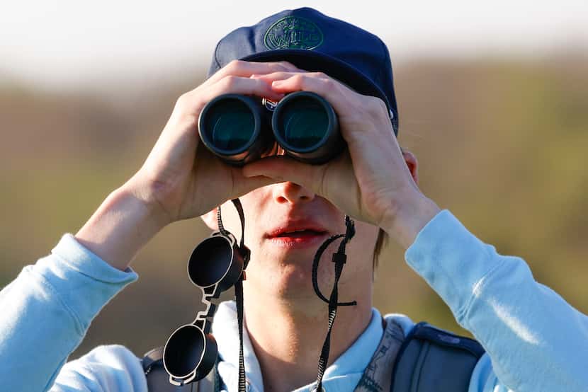 Birdwatcher Kalder Korte, looks through the binocular to spot birds at Harry S Moss Park, on...