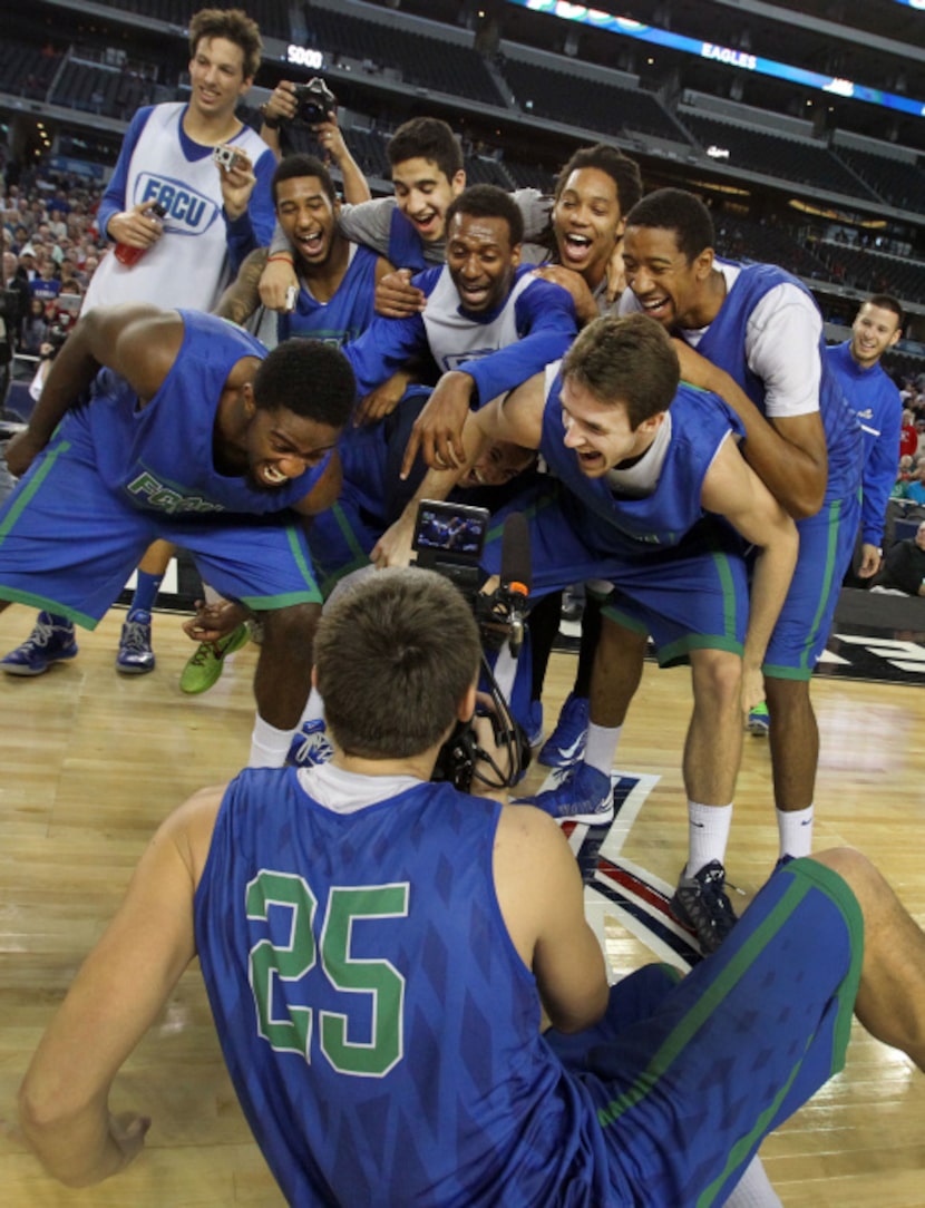 Florida Gulf Coast's Chase Fieler (25) videotaped his teammates as they clowned around at...