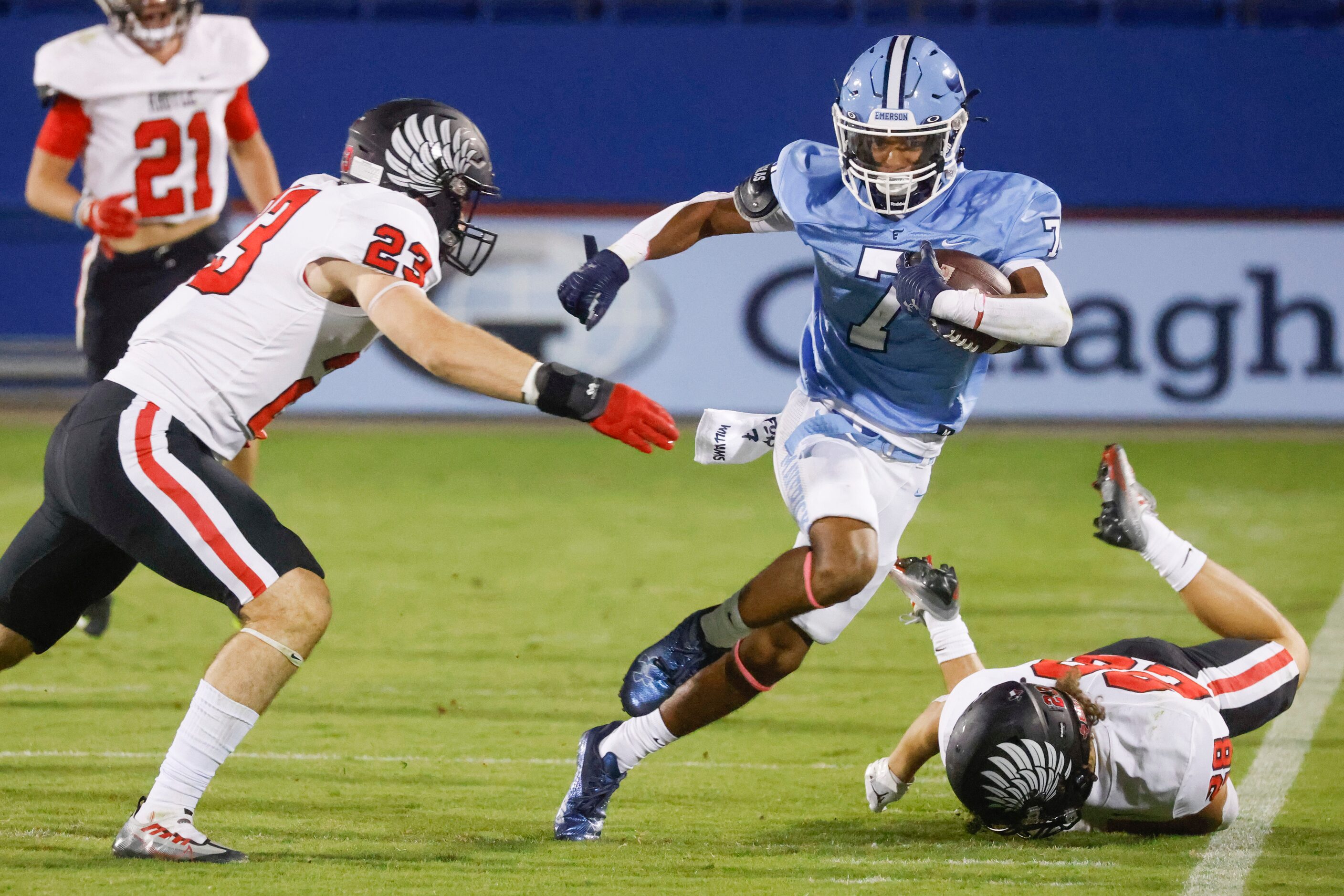 Emerson’s Jayson Williams (7), center, runs past  Argyle’s Hudson Emeterio (23), left, and...