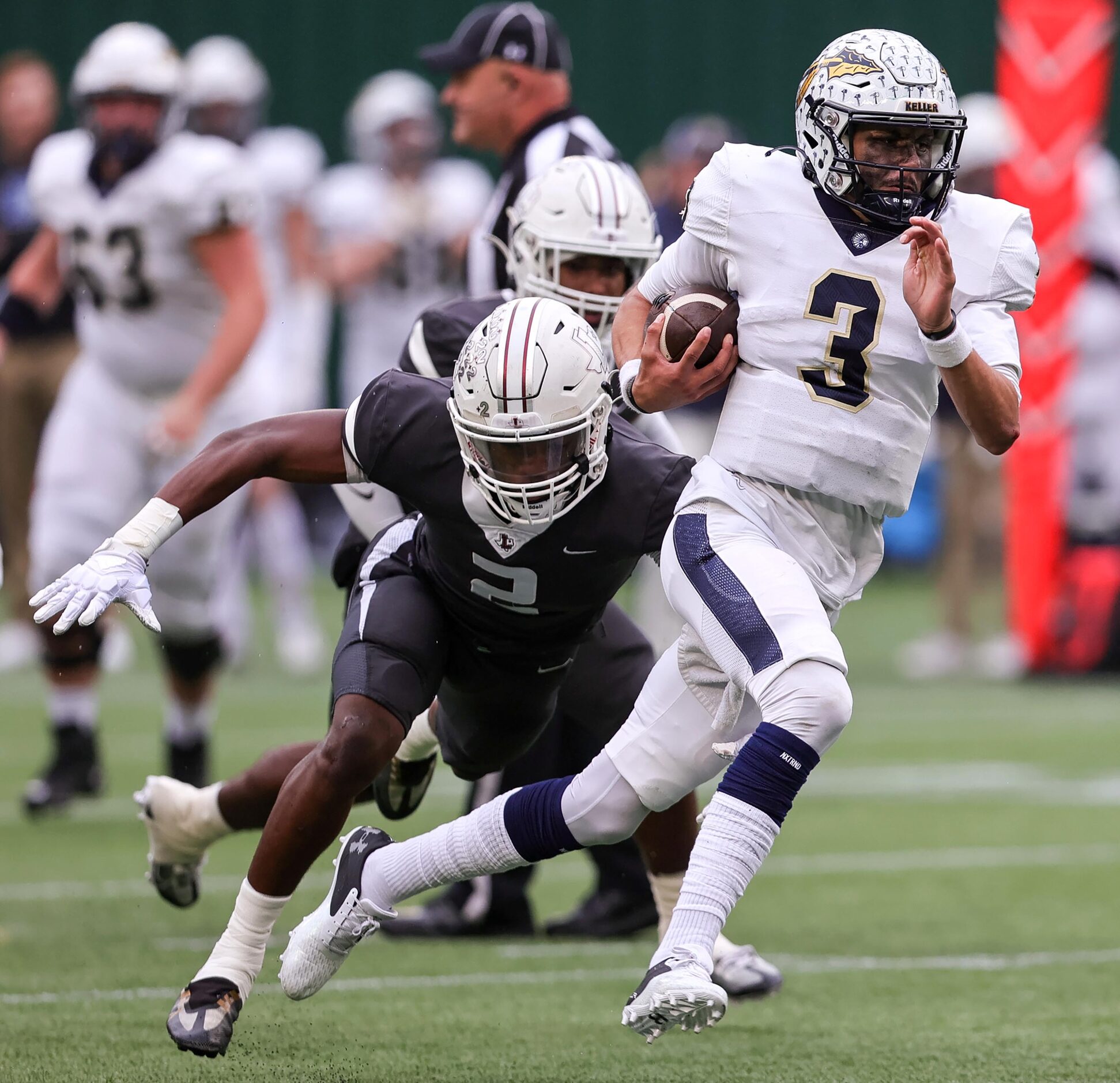 Keller quarterback Tre Guerra (3) finds room to run against Lewisville defensive back...