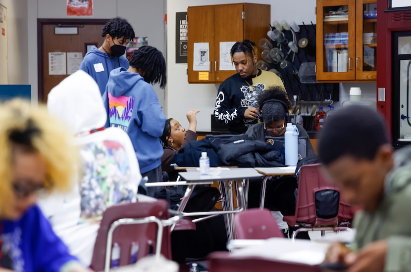 Plano Senior High School juniors and Black Student Union members Kennedi Johnson (center)...