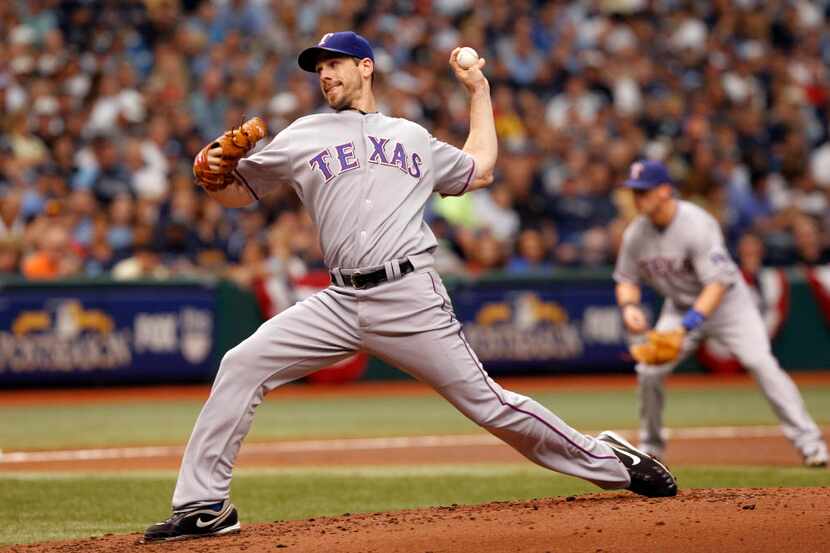 Texas Rangers' Cliff Lee (33) pitches in a game against the Tampa Bay Rays during the bottom...