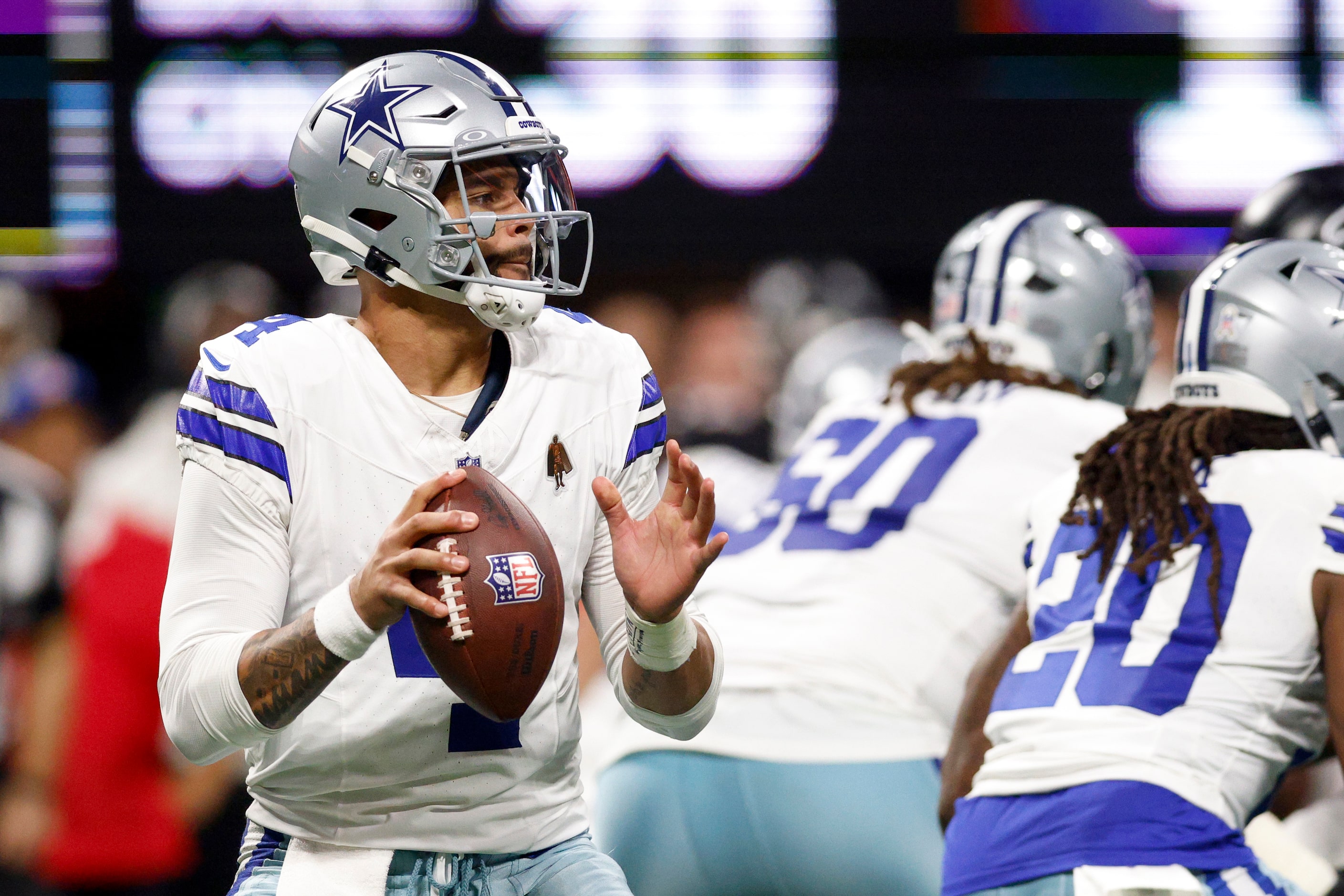 Dallas Cowboys quarterback Dak Prescott (4) drops back to pass during the second half...