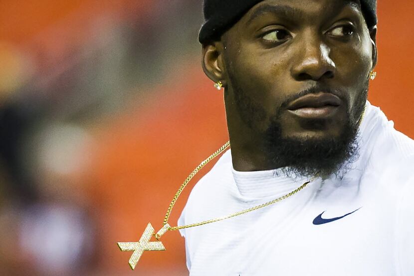 Dallas Cowboys wide receiver Dez Bryant warms up before an NFL football game against the...