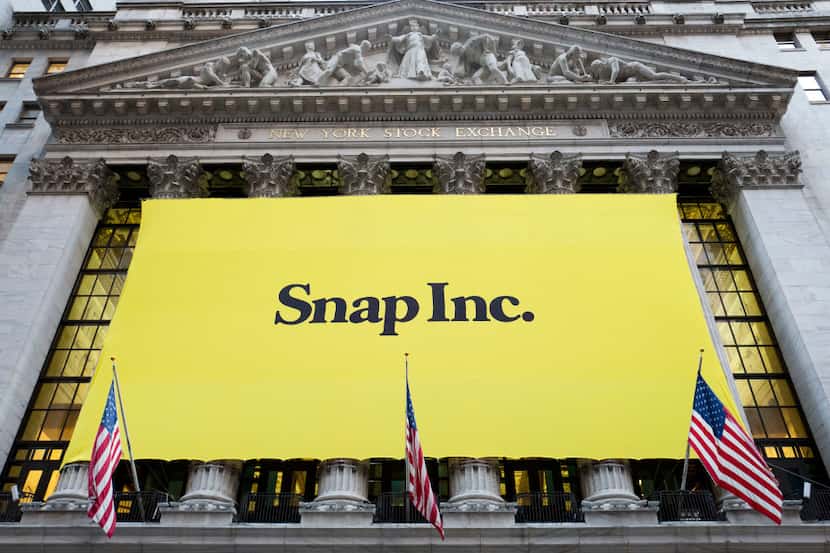 A banner for Snap Inc. hangs from the front of the New York Stock Exchange, Thursday, March...