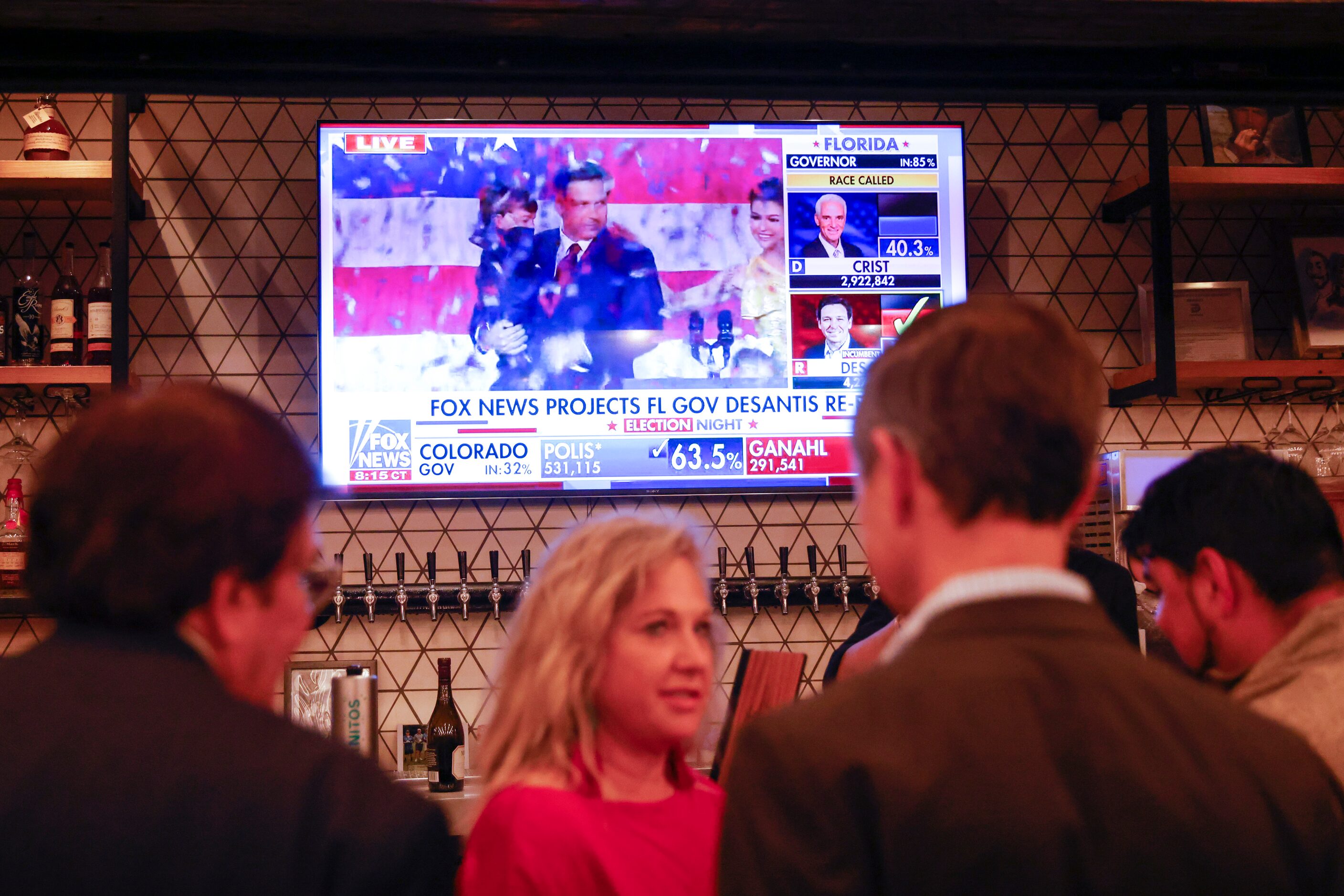 Supporters watch the speech of re-elected Florida Governor Ron DeSantis at Dallas County...