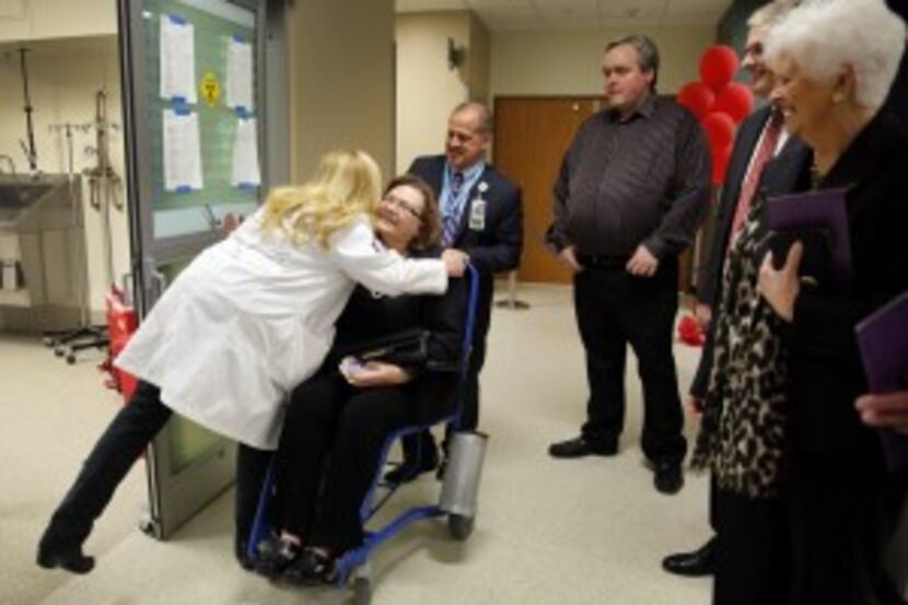  Parkland trauma and disaster director Jorie Klein (left) gave a big hug to Sue Ann Anderson...