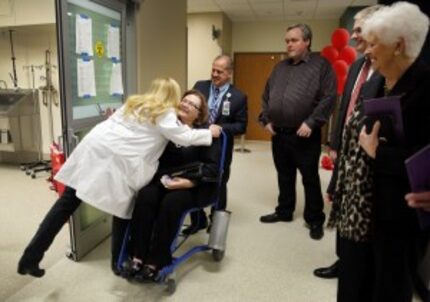  Parkland trauma and disaster director Jorie Klein (left) gave a big hug to Sue Ann Anderson...