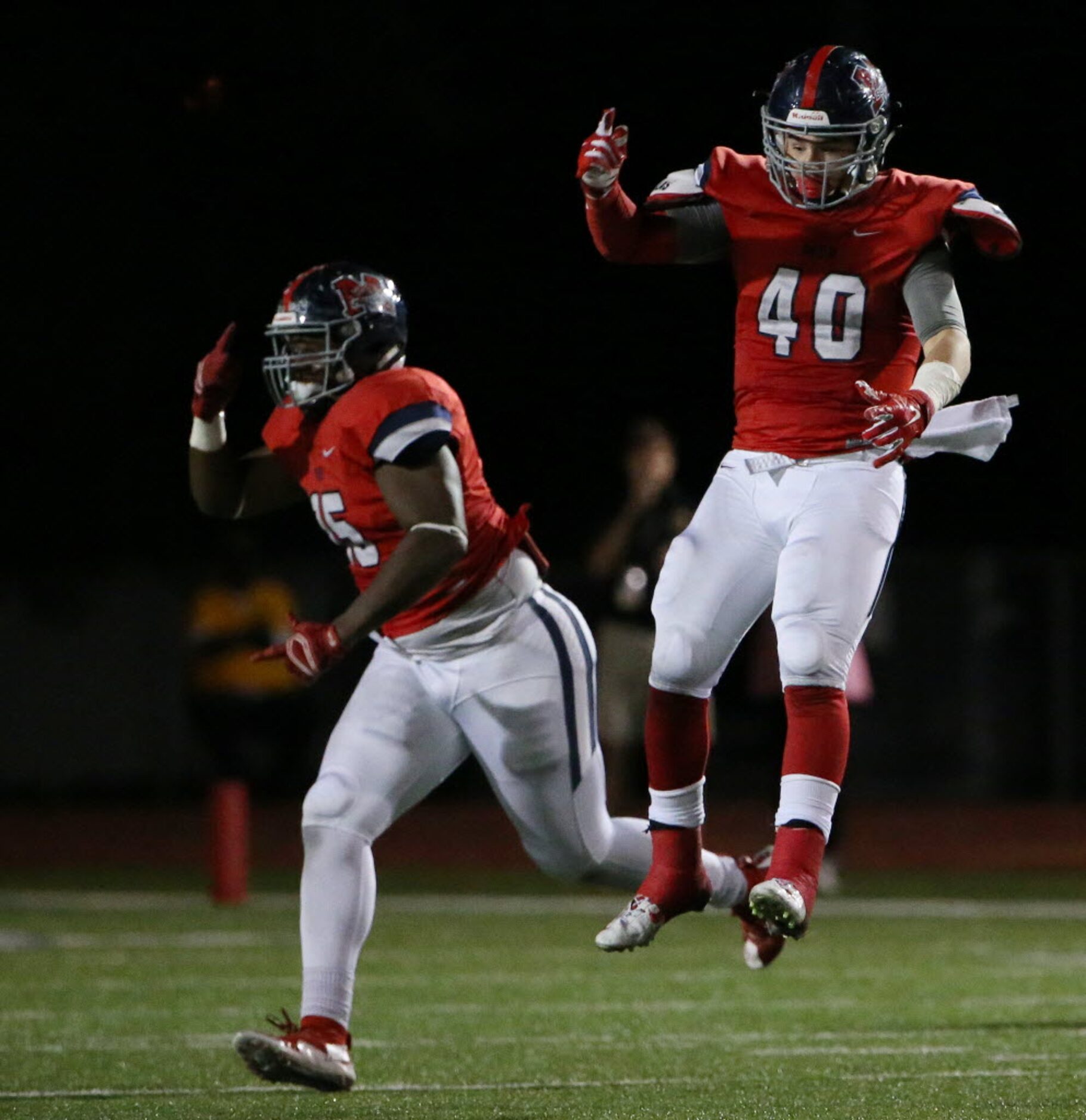 McKinney Boyd defensive lineman Ramon Readus (15) and linebacker Braydon Webb (40) celebrate...