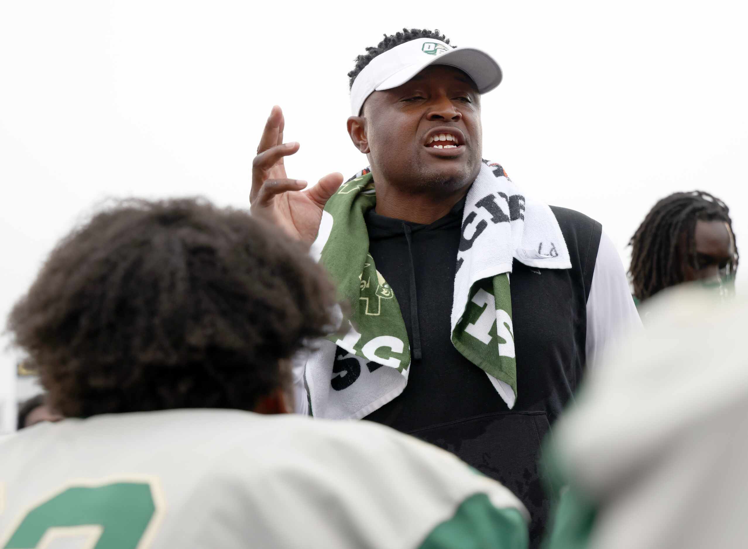 DeSoto head coach Claude Mathis speaks to his players after their 49-35 victory over...