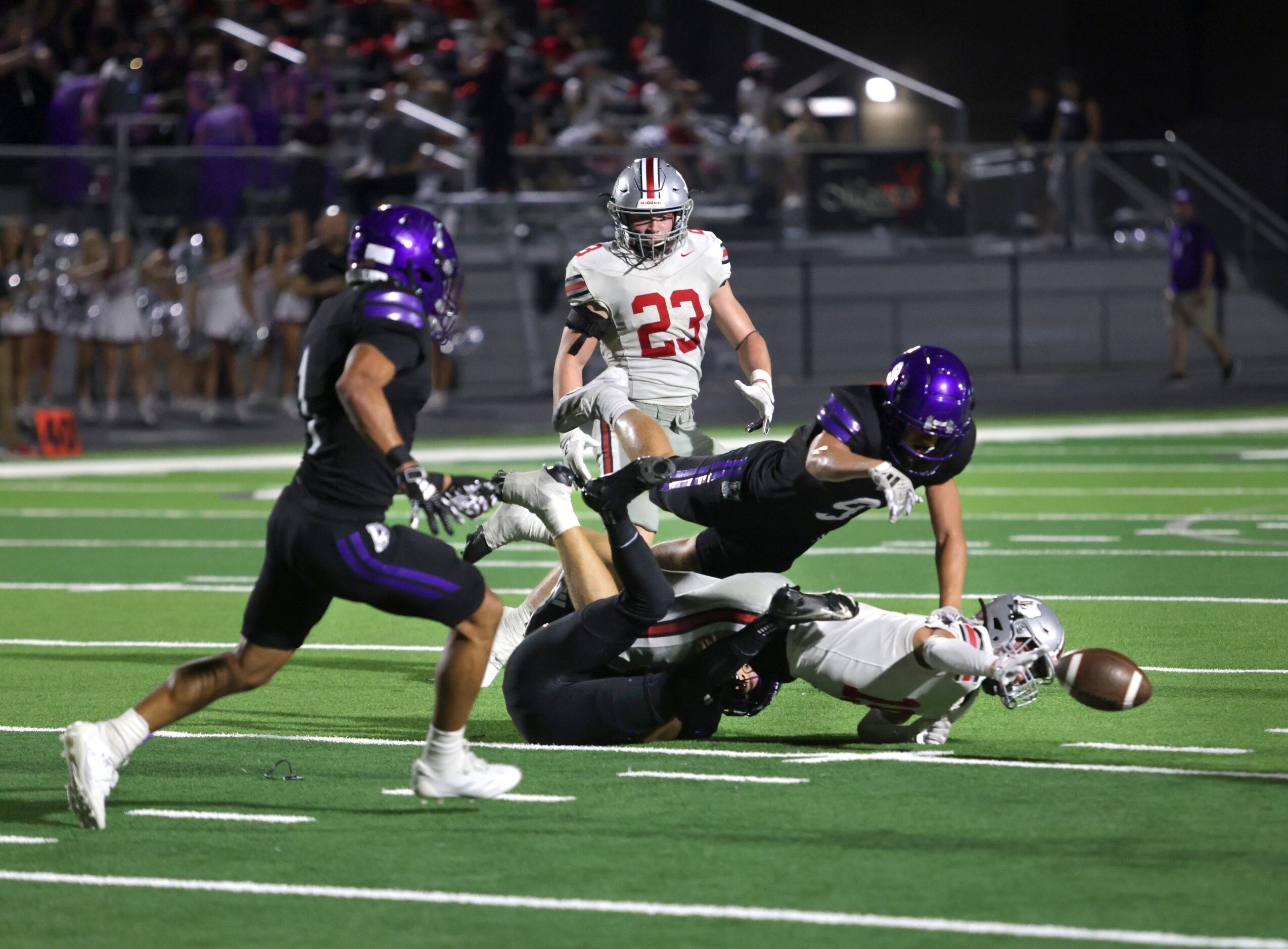 Boths teams struggle to gain control of the ball after a failed field goal attempt during...