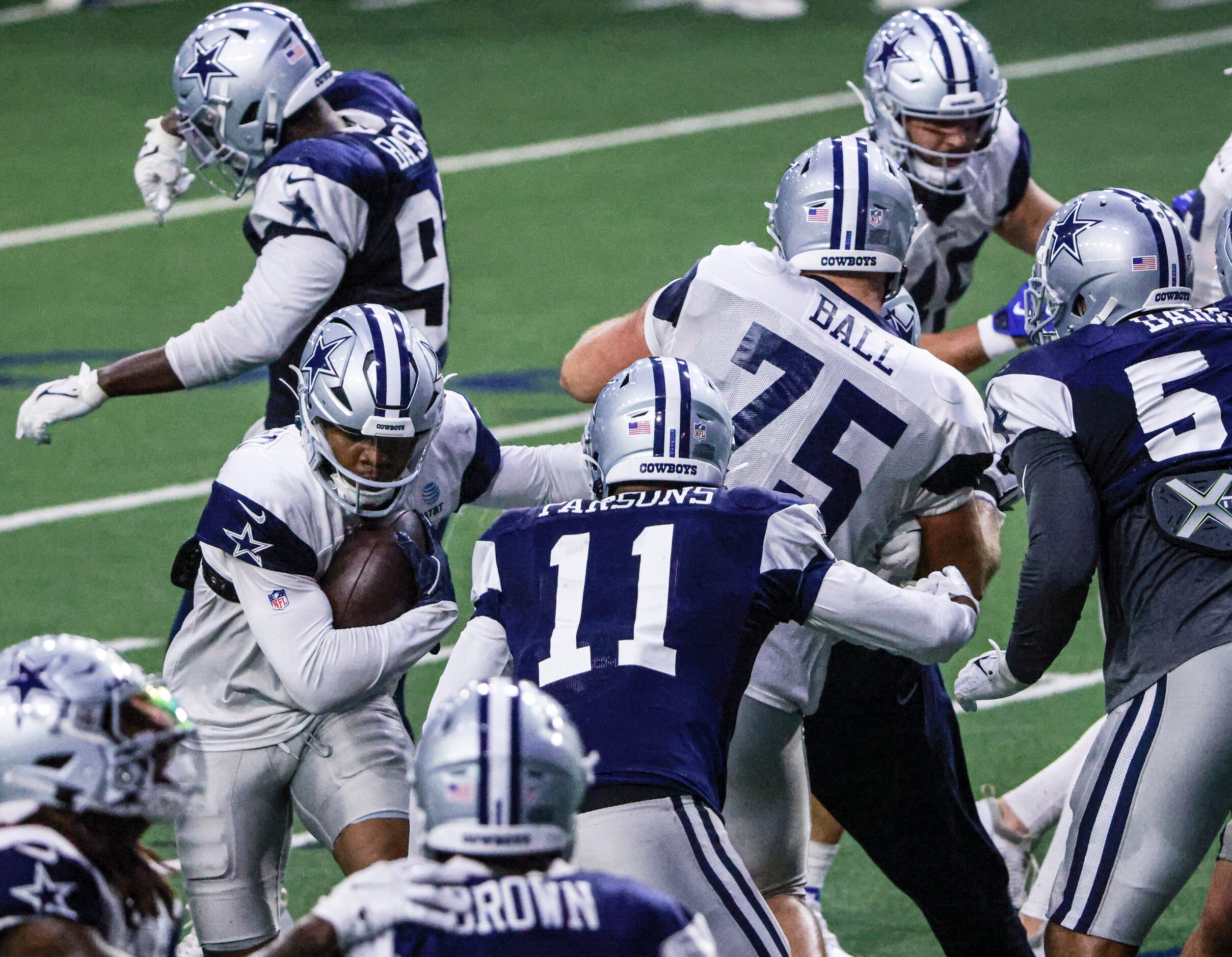 Dallas Cowboys running back Tony Pollard (20) runs the ball through the middle during the...