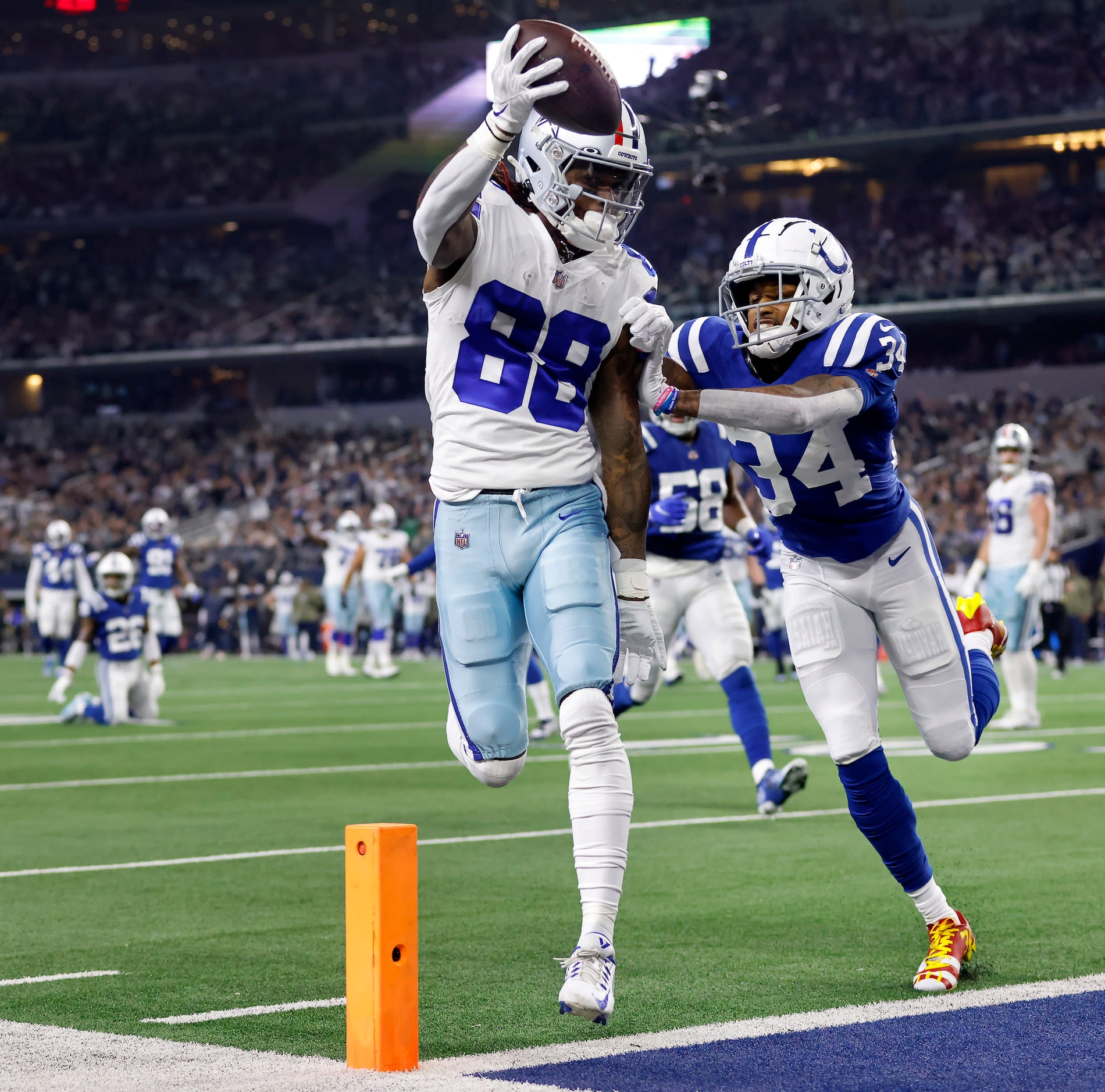 Dallas Cowboys wide receiver CeeDee Lamb (88) rolled off a defender and ran the ball in for...