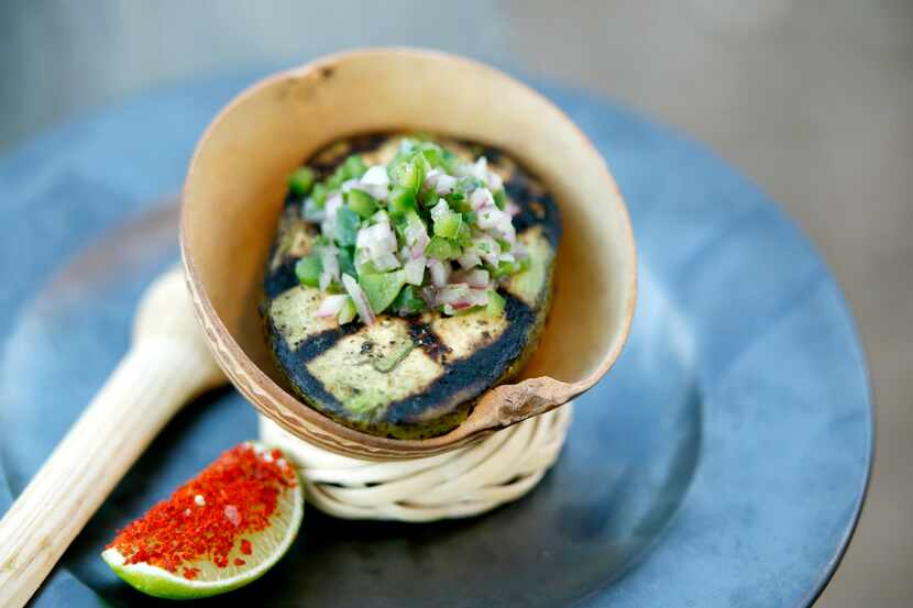 A grilled avocado with pico and lime at Capri (Guy Reynolds/The Dallas Morning News)